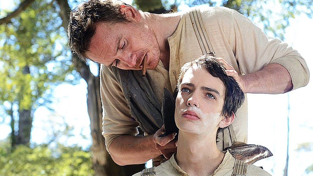 Michael Fassbender as Silas and Kodi Smit-McPhee as Jay.