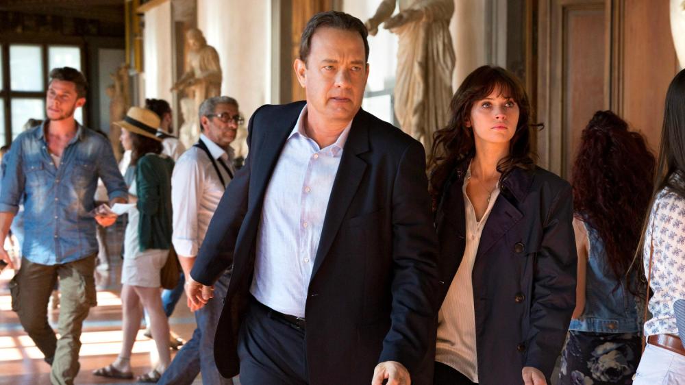 Tom Hanks as Robert Langdon and Felicity Jones as Dr. Sienna Brooks.